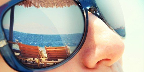 beach reflected in sunglasses
