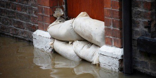 sandbags flood brick wall
