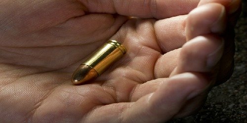 bullet in hand